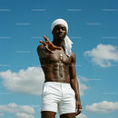 Confident Man Posing Under Clear Blue Sky