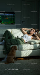 Woman Relaxing with Headphones and Dog in Cozy Living Room