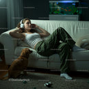 Woman Relaxing with Headphones and Golden Retriever at Home