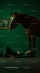Woman Lying on Floor with Elegant Horse in Green Room
