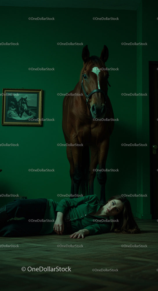 Horse Standing Over Woman in Dark Green Room