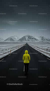 Solitary Figure in Yellow Jacket Facing Snowy Mountains