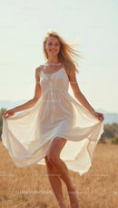 Joyful Woman in Flowing White Dress in Golden Fields