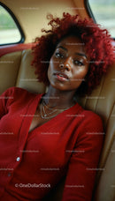 Elegant Woman in Red Outfit Relaxing in Car