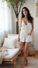 Woman in White Summer Outfit Relaxing Indoors