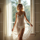 Elegant Woman in Sheer Dress Enjoying Morning Sunlight
