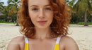 Woman with Red Hair Relaxing on a Tropical Beach