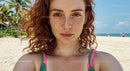 Redhead Woman with Freckles on a Tropical Beach