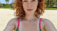 Red-Haired Woman Taking Selfie on Tropical Beach