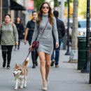 Stylish Woman Walking Husky Dog in City Street
