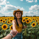 Woman in Cowboy Hat Holding Hands in Sunflower Field