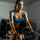 Woman Focused on Intense Indoor Cycling Workout