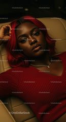Fashionable Woman with Striking Red Hair Relaxing in Style
