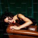 Elegant Woman in Black Dress on Leather Couch