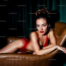 Elegant Woman in Red Dress on Leather Chair