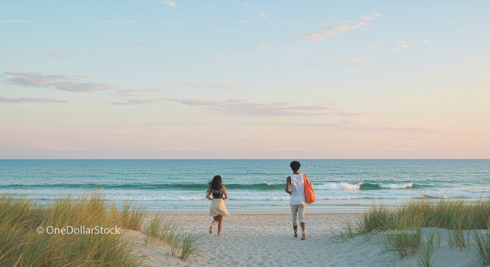 Couple Walking on Beach at Sunrise with Ocean View