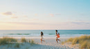 Couple Running on a Sandy Beach at Sunset