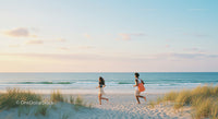 Couple Running on a Sandy Beach at Sunset