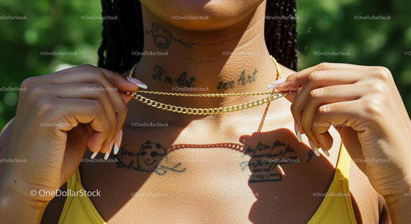 Stylish Gold Chain and Tattoos in Summer Sunlight