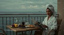 Woman Enjoying Breakfast on Balcony with Ocean View