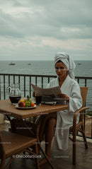Woman Relaxing in Bathrobe with Ocean View Breakfast