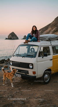 Woman and Dog on Vintage Van by the Sea at Sunset