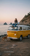 Woman Relaxing on Yellow Van by Scenic Sunset Beach