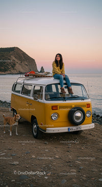 Woman Enjoying Sunset on Classic Yellow Van by the Sea