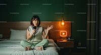 Young Woman Podcasting from Cozy Bedroom
