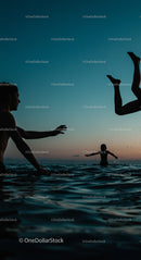 Silhouetted Friends Playing in the Ocean at Sunset