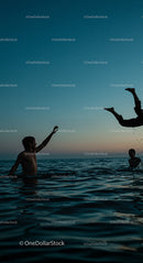 Friends Enjoying Sunset Splash in the Ocean