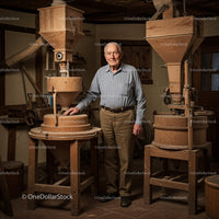 Elderly Man with Rustic Wooden Grain Mill in Historical Workshop