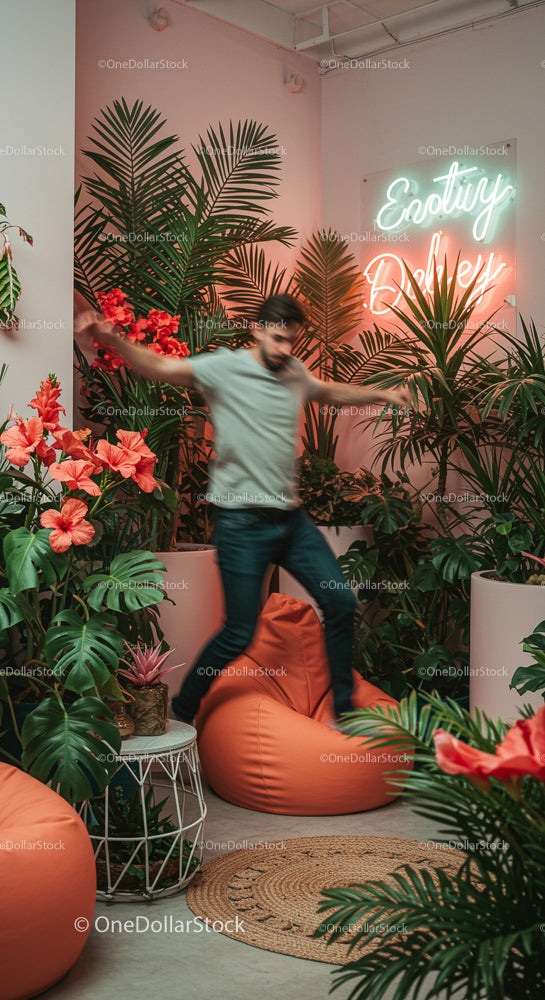 Man Enjoying Indoor Jungle with Lush Hibiscus and Neon Sign