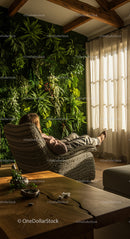 Woman Relaxing in Chair by Indoor Vertical Garden