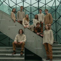 Group of Young Adults in Neutral Attire on Concrete Stairs