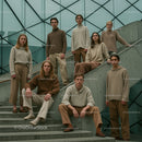 Stylish Group in Minimalist Beige Fashion on Urban Stairs