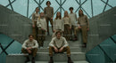 Group of Young Adults in Neutral Tones on Staircase