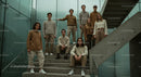 Group of Young People in Neutral Toned Fashion on Stairs