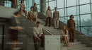 Young Adults on Concrete Stairs in Modern Building