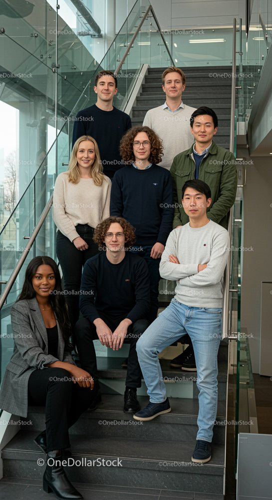 Diverse Business Team on Modern Office Staircase