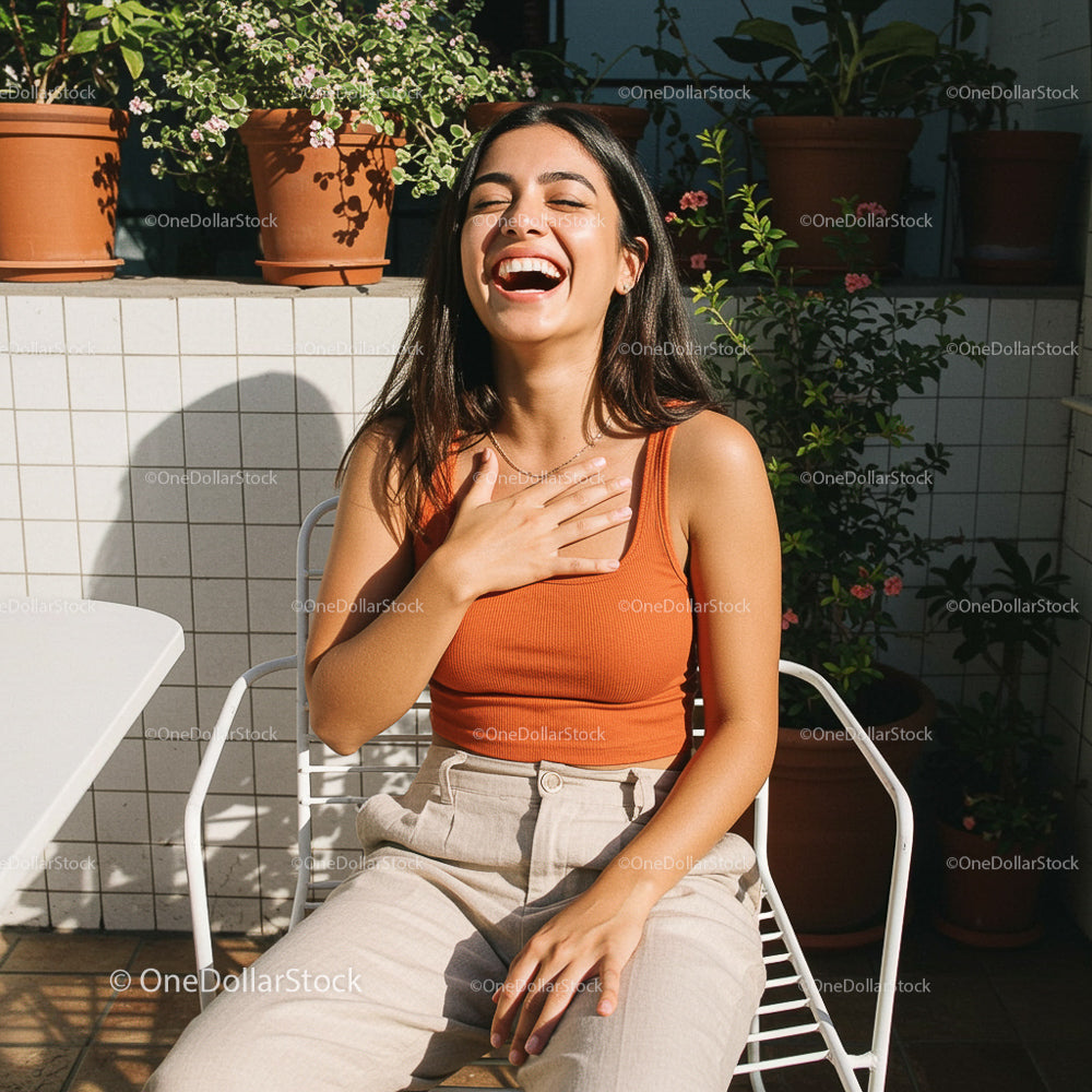 Smiling Woman Enjoying a Sunny Day on the Patio