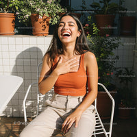 Smiling Woman Enjoying a Sunny Day on the Patio