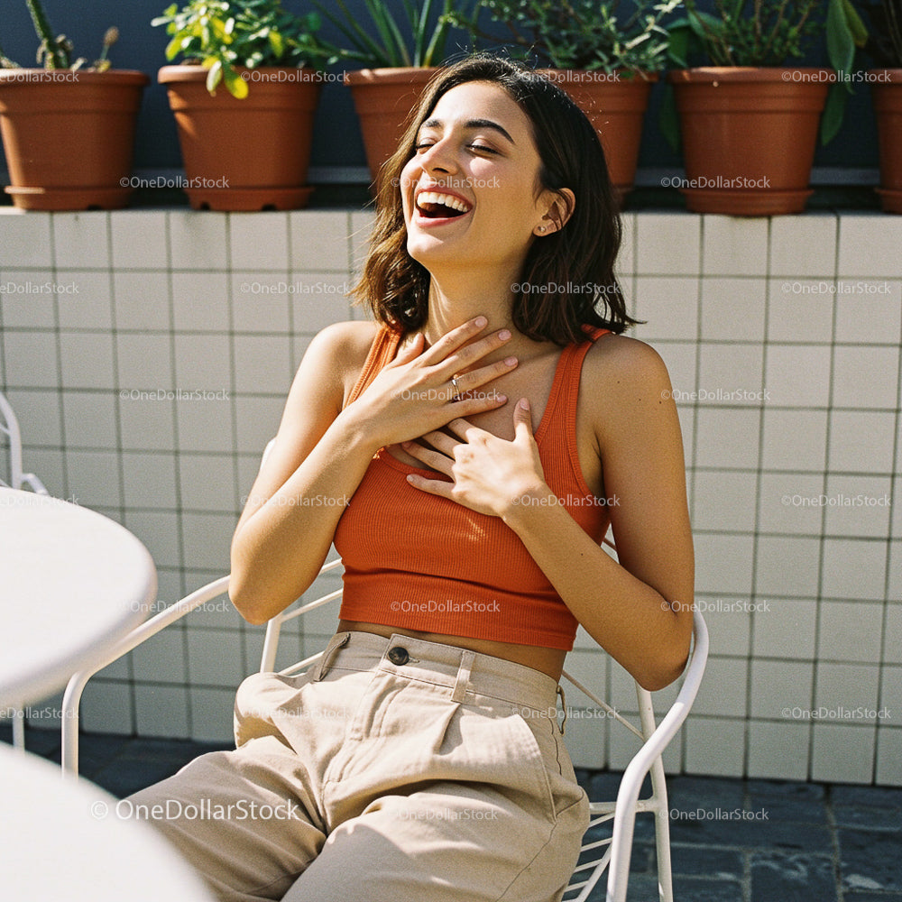 Joyful Woman Laughing on a Sunny Terrace with Potted Plants