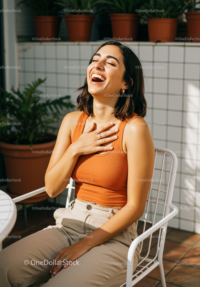 Joyful Woman Relaxing in Outdoor Patio with Plants