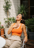 Joyful Woman Relaxing in Summer Garden with Lush Foliage