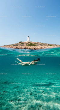Snorkeler Exploring by Lighthouse Island in Turquoise Waters