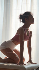 Silhouette of Woman Practicing Yoga in Natural Light