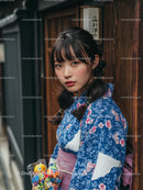 Young Woman in Traditional Blue Floral Kimono