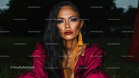 Elegant Woman with Bold Makeup in Mysterious Setting