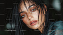 Close-up Portrait of a Woman with Wet Hair and Intense Gaze